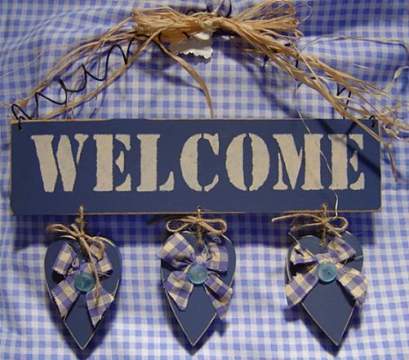 Welcome Sign with Hanging Hearts
